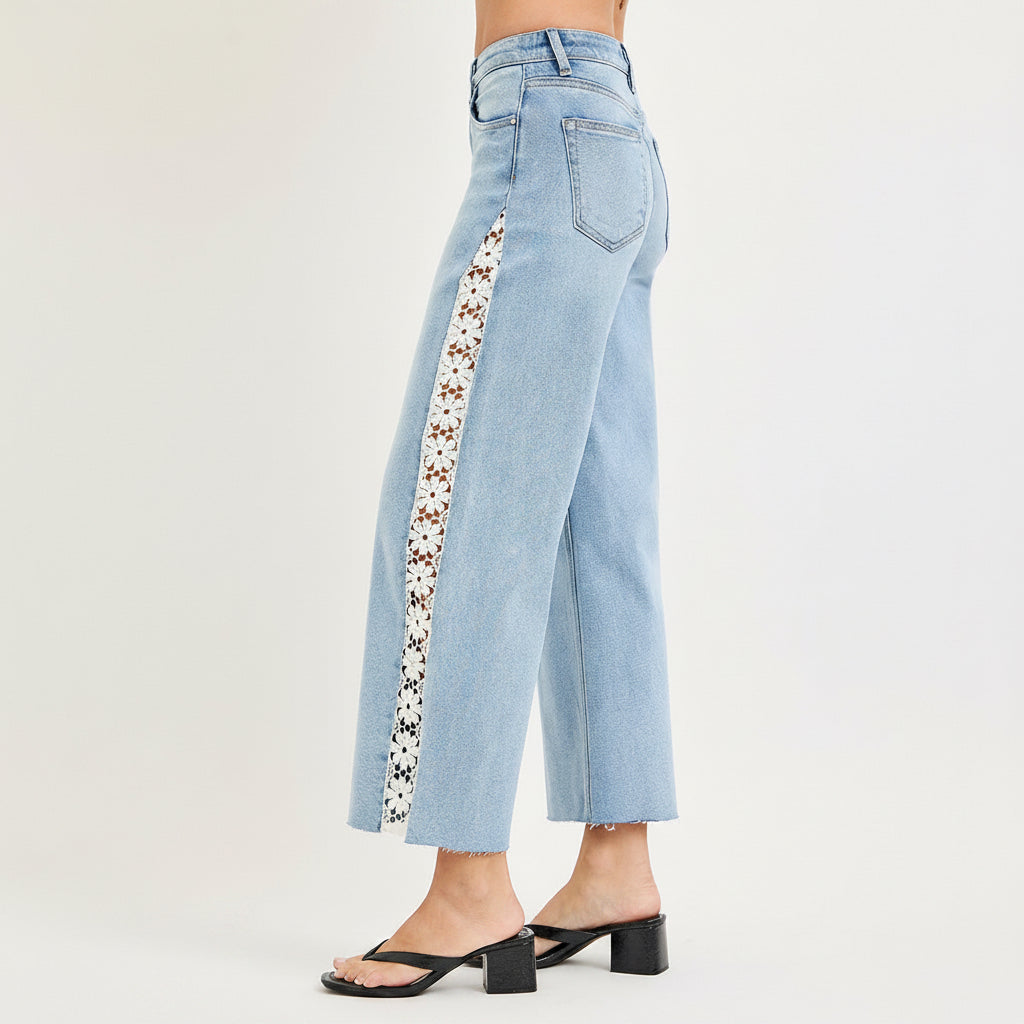 Front view of Risen high rise crop wide leg jeans in light wash with lace side panels on both legs