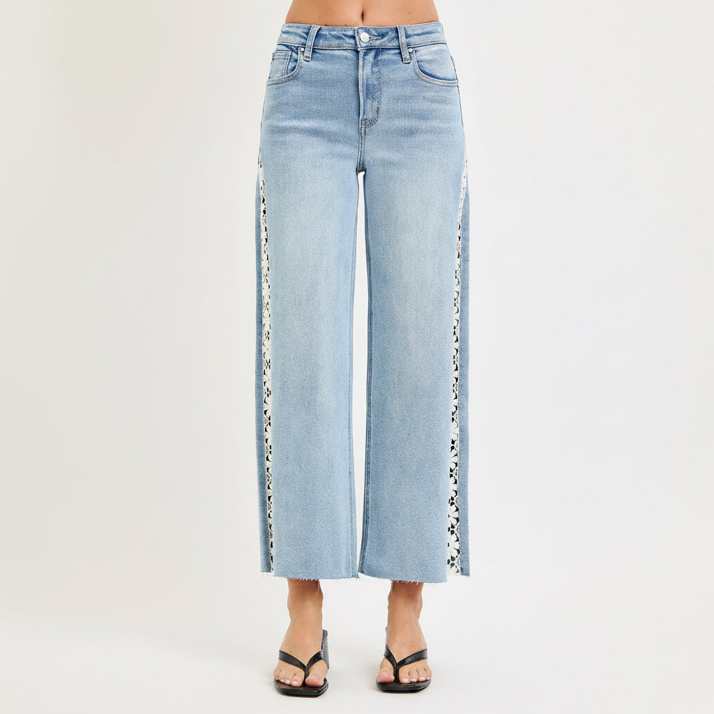 Back view of Risen light wash crop wide leg jeans with patch pockets and raw cropped hems