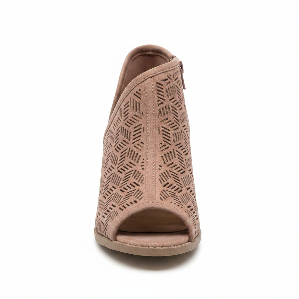 Front view of women's dusty blush peep toe ankle bootie with geometric laser cut suede upper and open toe silhouette