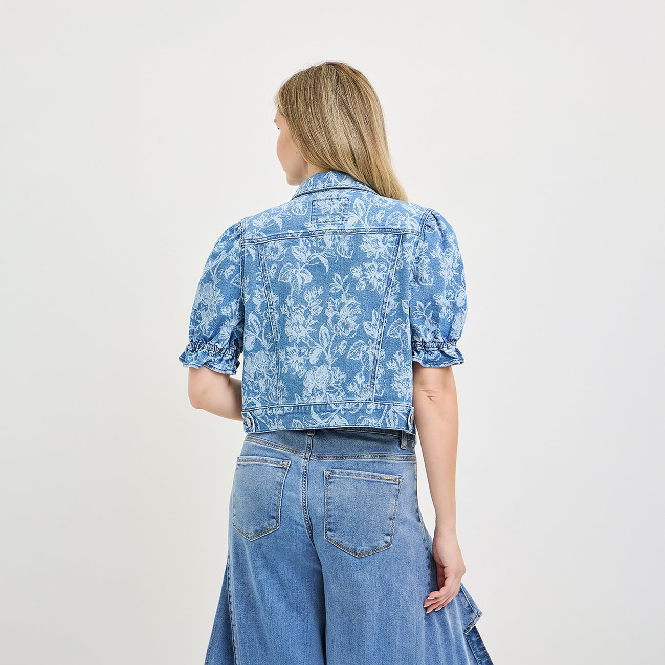 Risen floral cropped denim jacket with puff sleeves, medium wash, side profile view

