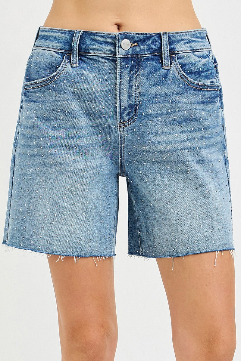 Blue denim shorts on a white background
