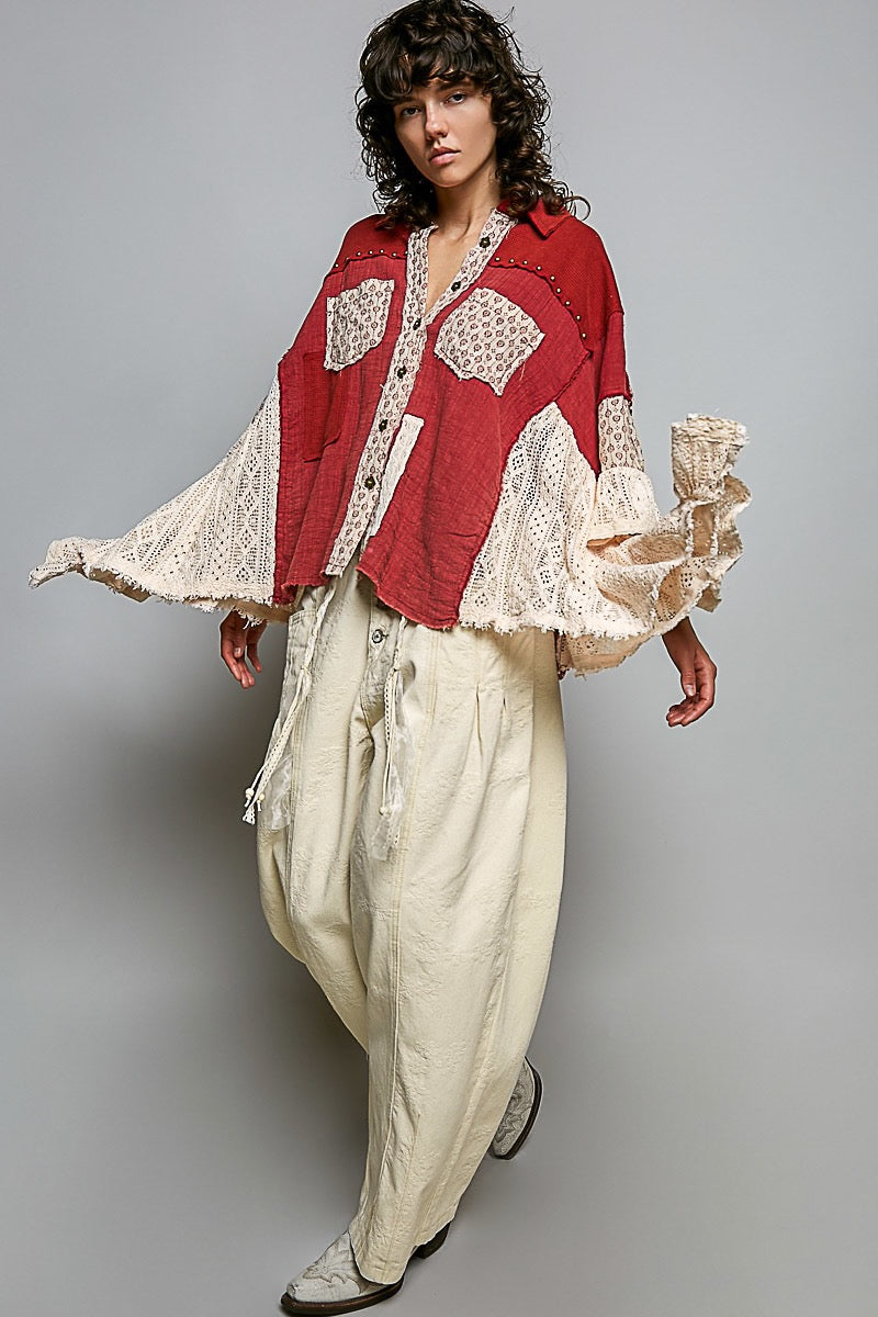 POL Clothing ruby red lace double-gauze shirt close-up, patterned pockets and layered cream crochet sleeves