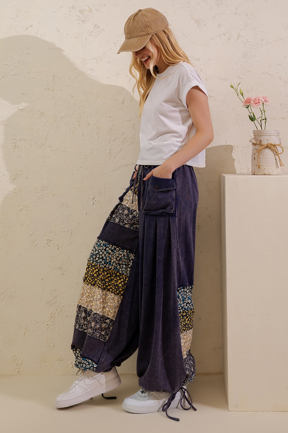 Sage + Fig Garden Trail navy patchwork pants styled with a white tee, full front view