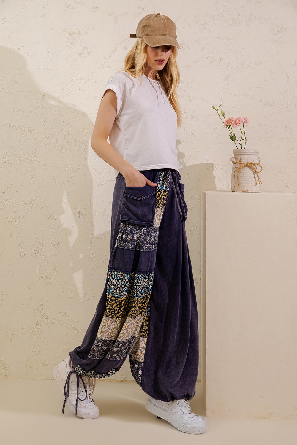 Sage + Fig navy wide-leg cotton patchwork pants from the side with drawstring hems