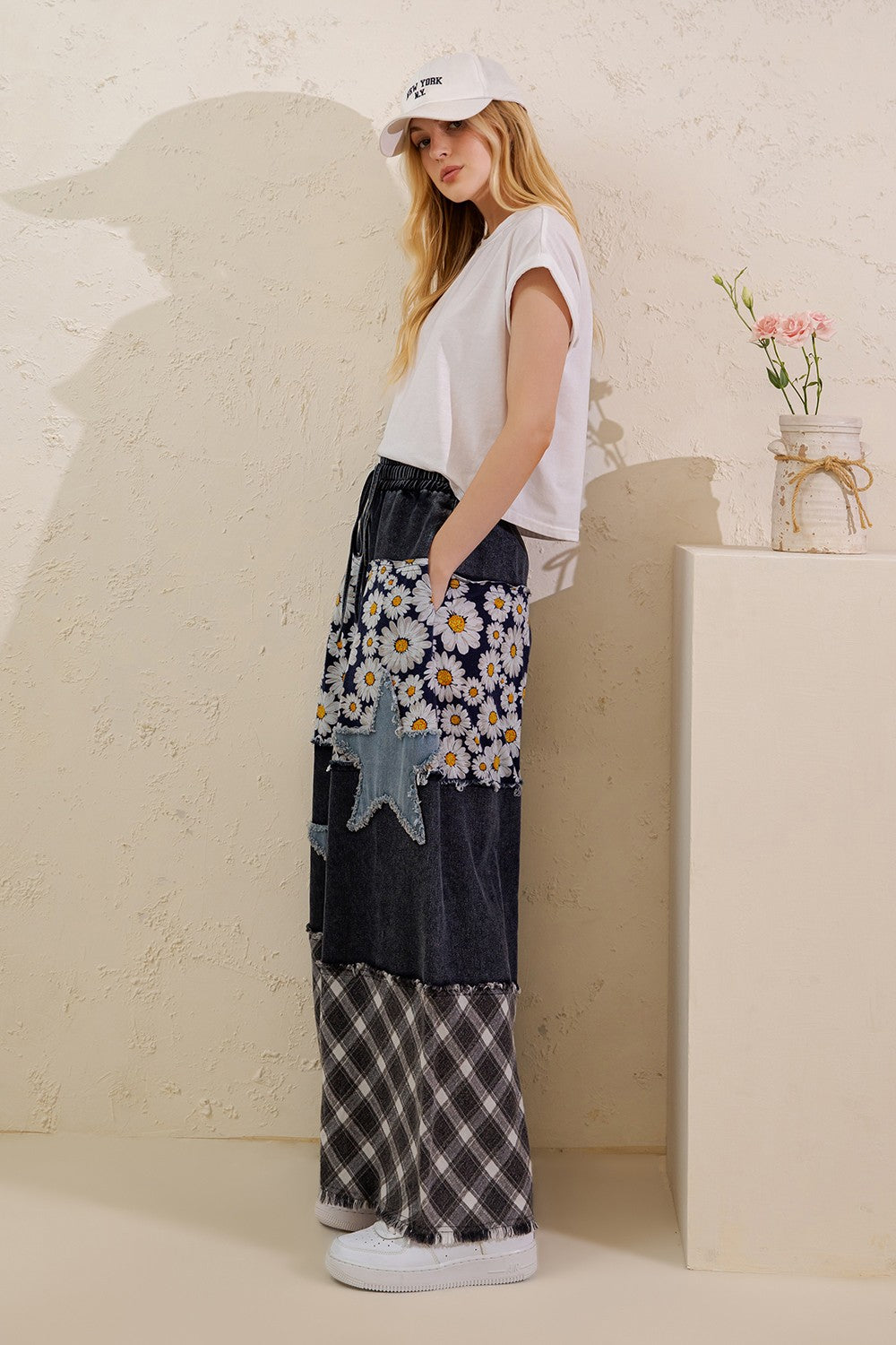 Sage + Fig women's denim star patchwork pants, full-length side view with floral and plaid panels