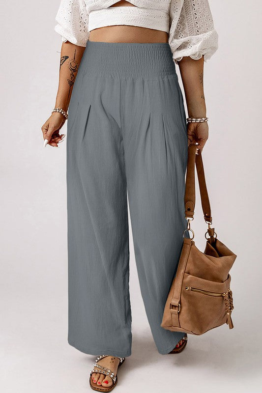 a woman in a white top is holding a purse
