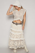 Back view of women's white crochet skirt showing shirred ruffle detailing and roomy fit silhouette