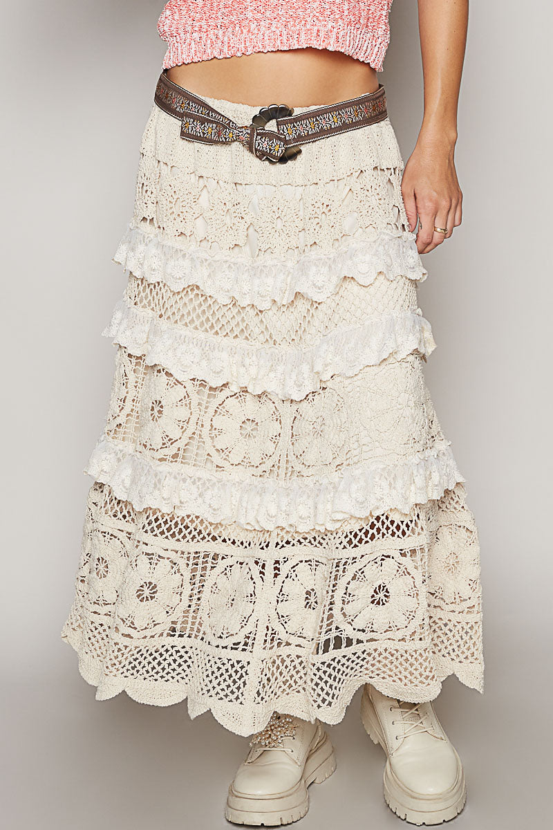 Women's roomy fit white crochet skirt with shirred ruffle hem worn with a pink crop top