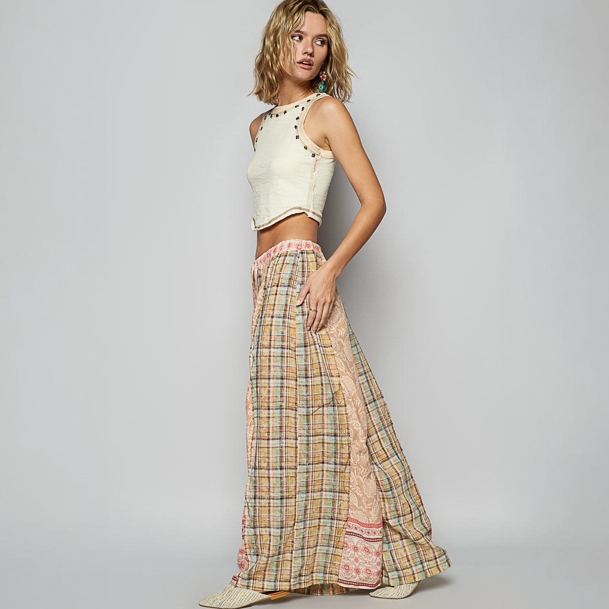 POL Clothing women's mocha patchwork wide-leg pants showing plaid side panels and contrasting floral hem
