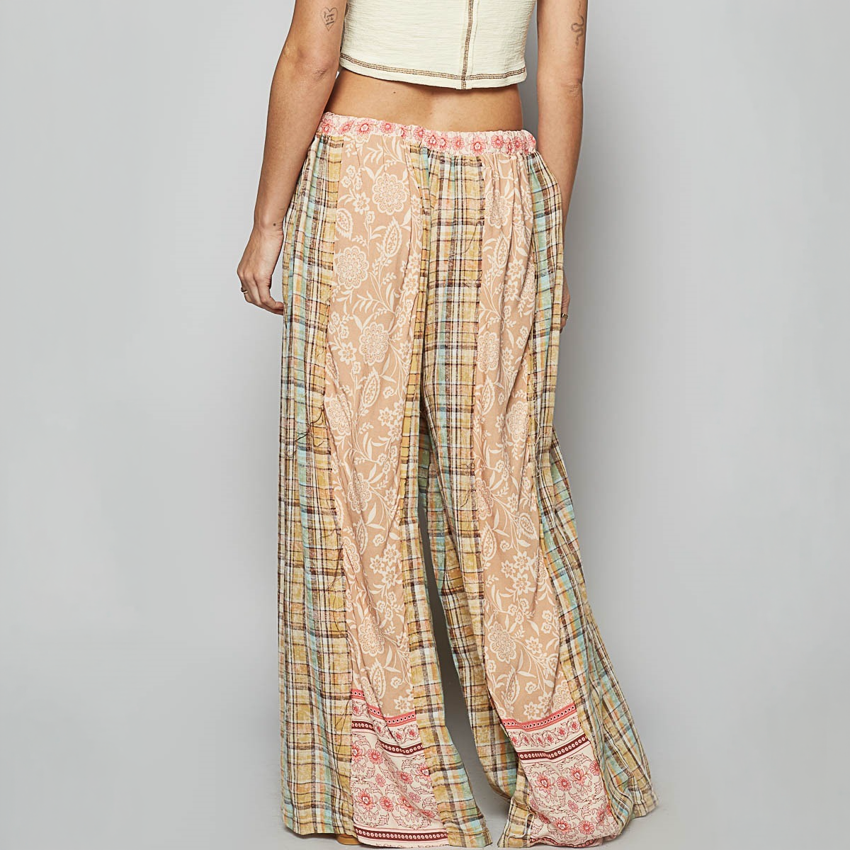 POL Clothing women's mocha floral and plaid wide-leg pants, rear view with pink floral hem borders
