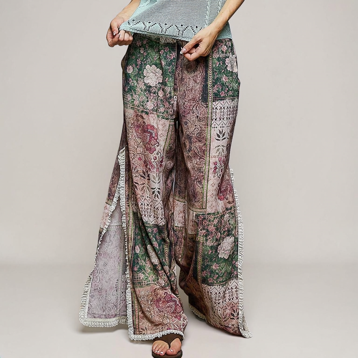 POL Clothing Rose Multi patchwork pants, close-up of pink paisley, green floral motifs and cream lace edging.
