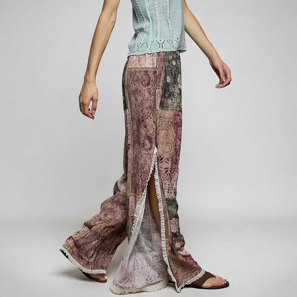 POL Clothing Rose Multi boho wide-leg pants, side view showing a deep lace-trimmed slit and pink paisley print.
