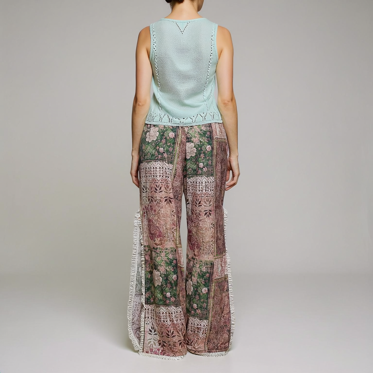 POL Clothing Rose Multi patchwork wide-leg pants, back view with pink and green floral print and cream lace hems.
