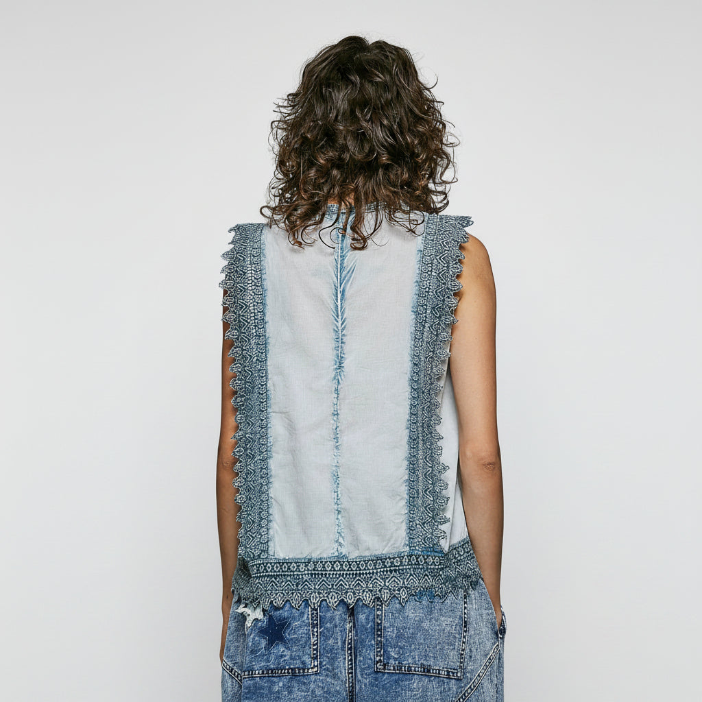 POL Clothing Person wearing a sleeveless denim dress with intricate lace detailing on a plain background