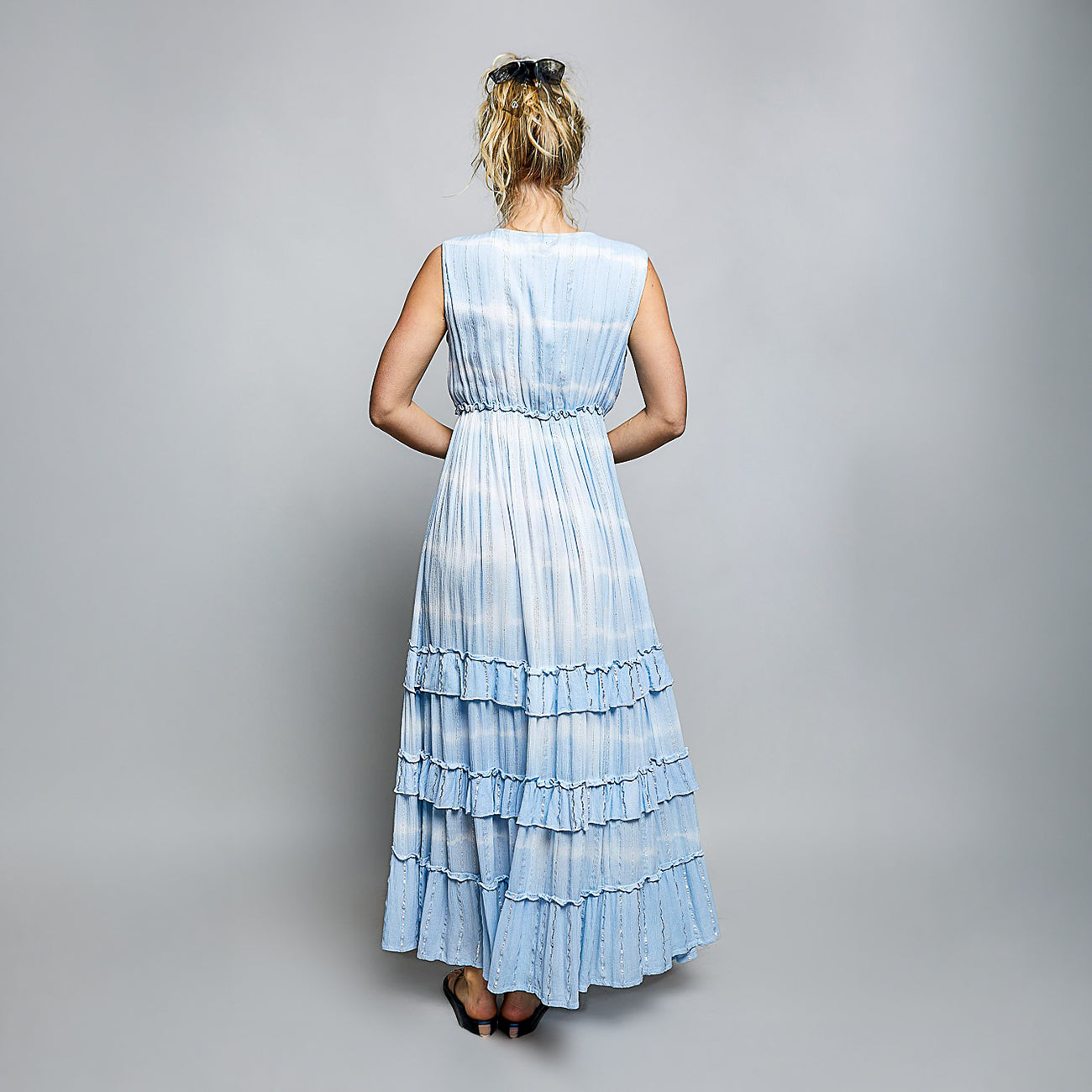 POL Clothing women's sky blue tiered ruffle maxi dress, back view studio, sleeveless silhouette