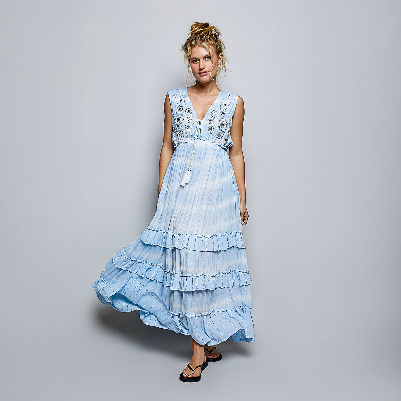 POL Clothing women's sky blue embroidered maxi dress, front studio view, skirt in motion showing tiered ruffles