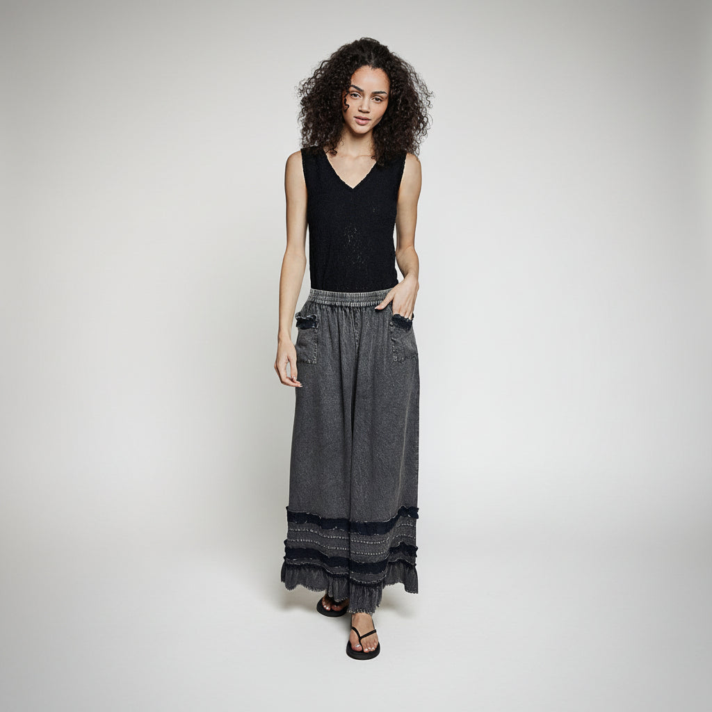 Women's charcoal washed wide-leg ruffle hem pants, relaxed fit, front view with black sleeveless top - BellanBlue