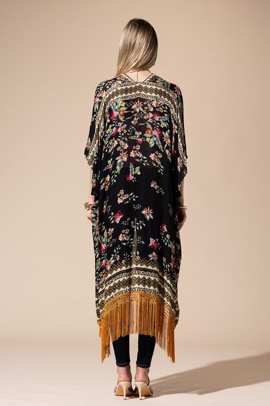 a woman in a black floral print dress