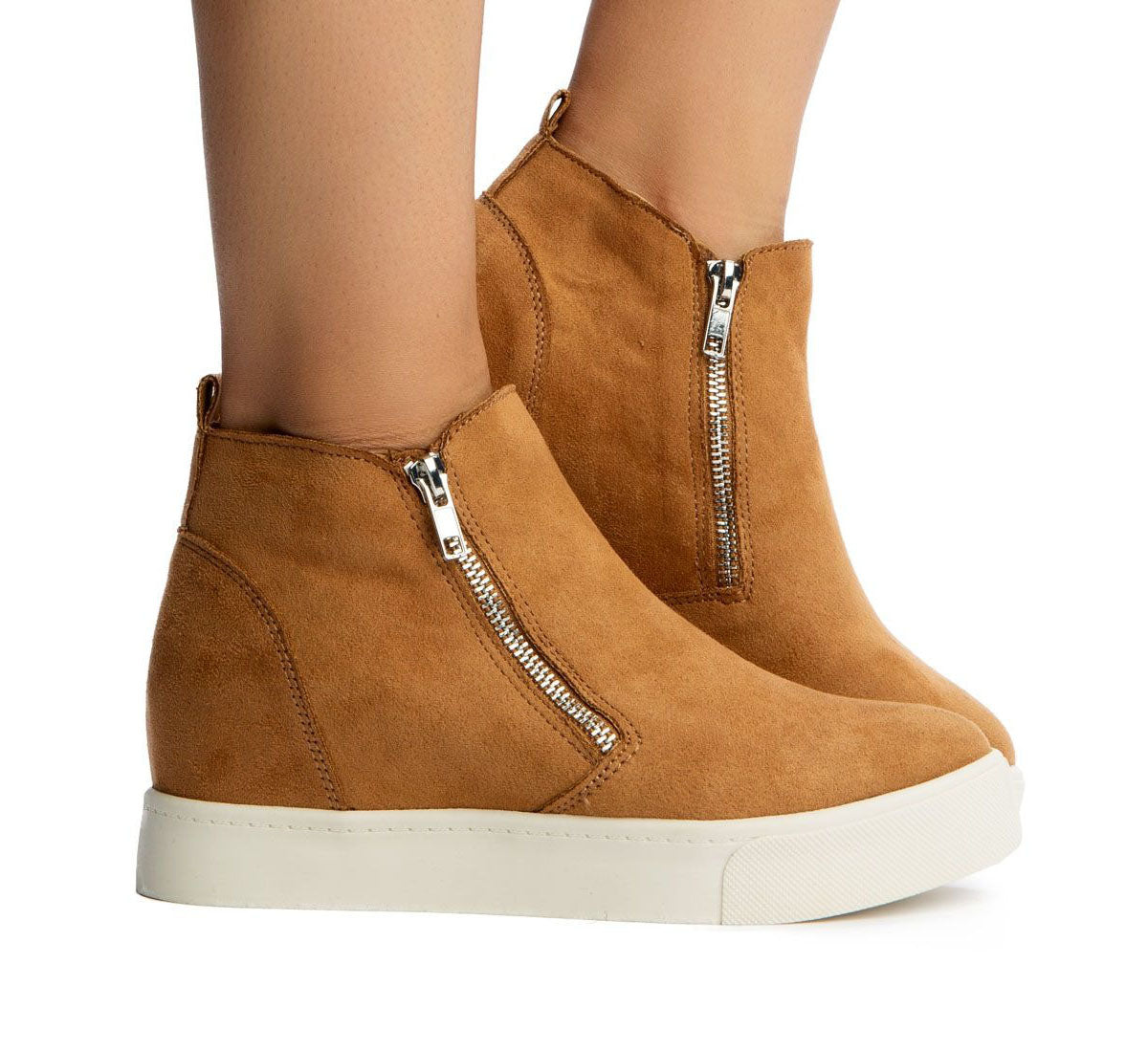 Brown suede ankle boots with zippers on a white background