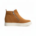 Brown suede wedge sneakers with zippers on a white background