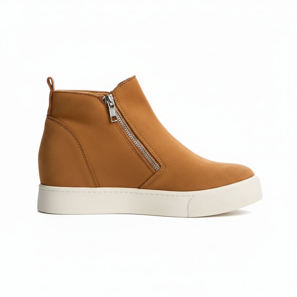 Brown suede wedge sneakers with zippers on a white background