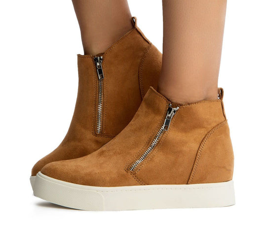 Brown suede wedge sneakers with zippers on a white background