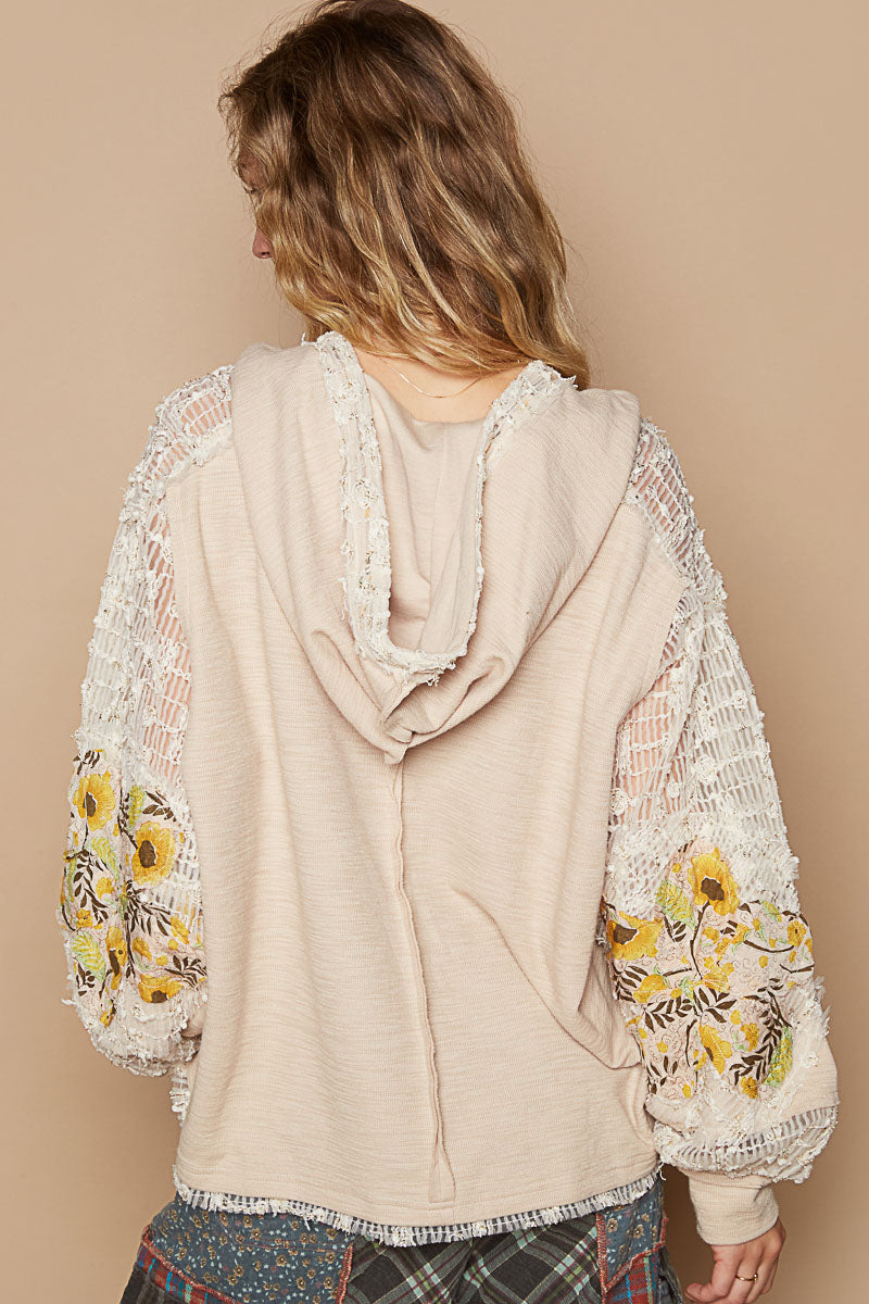 Women's beige vintage wash knit hoodie top balloon sleeve — back view showing lace and star patch detail