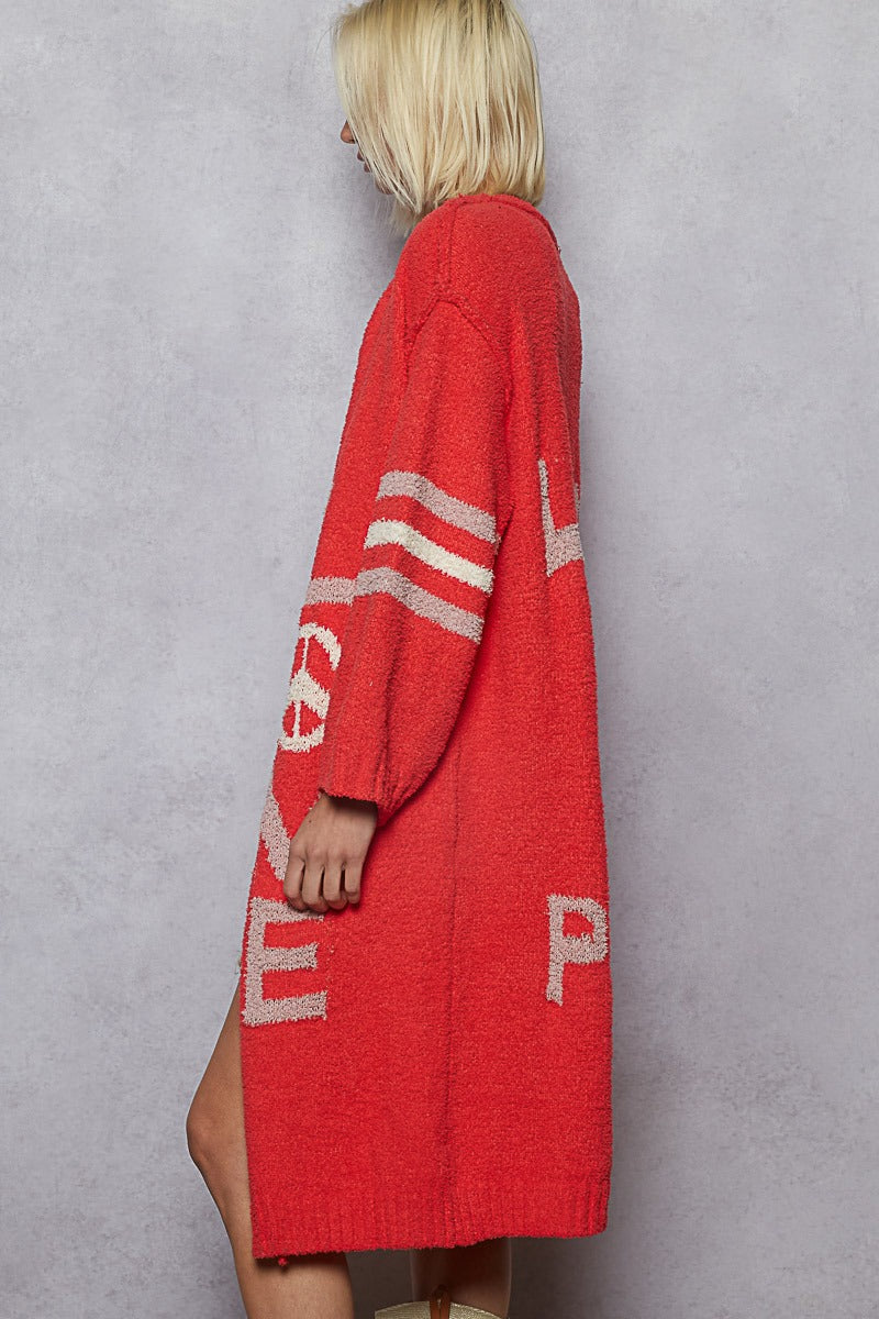 Person wearing a red cardigan with white text on a gray background