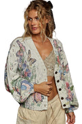 Woman wearing a floral cardigan with butterfly designs on a white background