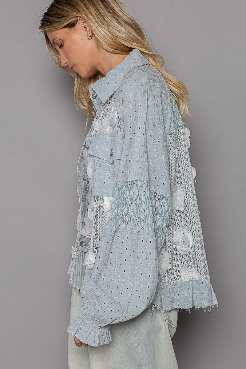 a woman wearing a blue shirt and white pants