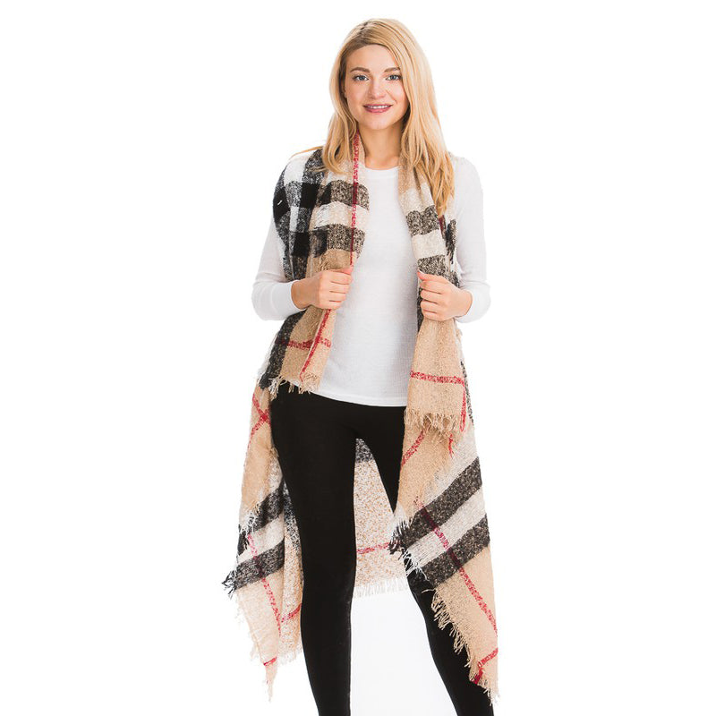Women's camel plaid wrap shawl layered over casual outfit with leggings, boho weekend styling