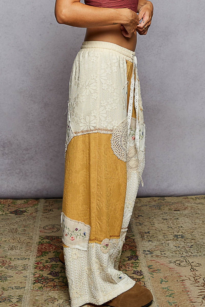 Skirt with white and yellow pattern on a textured floor