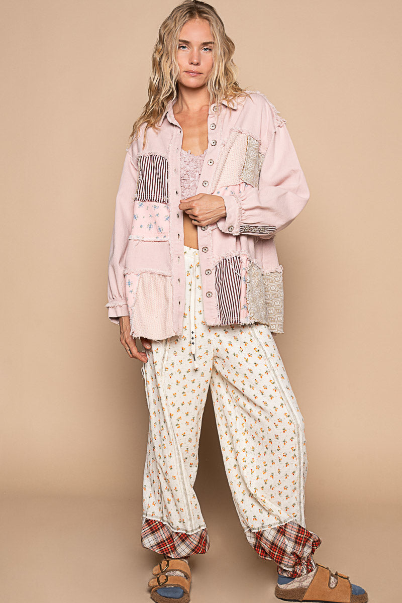 a woman wearing pajamas and a pink jacket