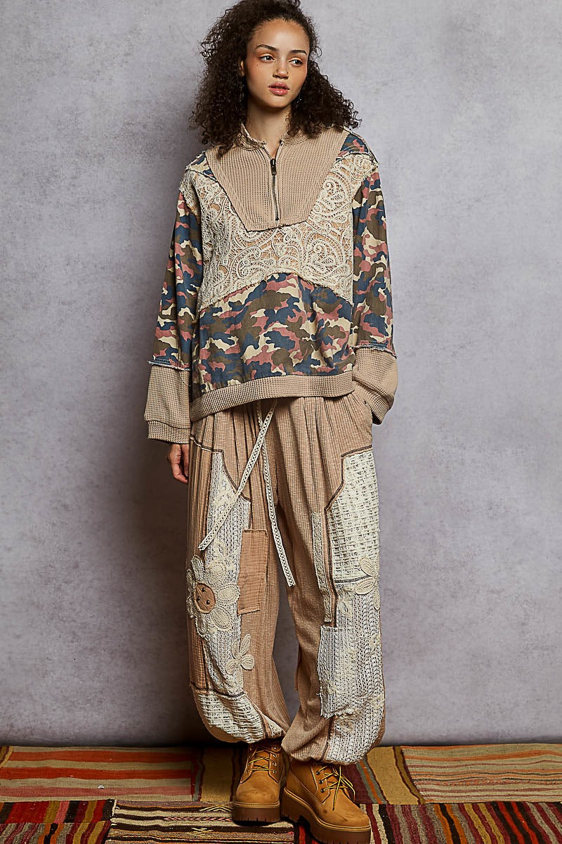 Woman wearing a patterned outfit with a neutral background