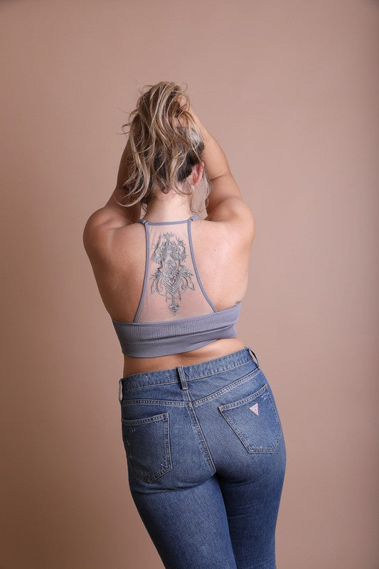 a woman with a tattoo on her back