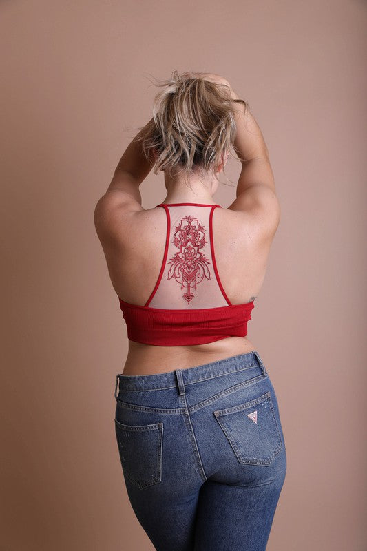 a woman with a tattoo on her back