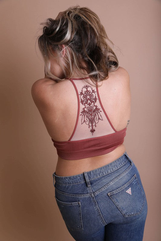 a woman with a tattoo on her back