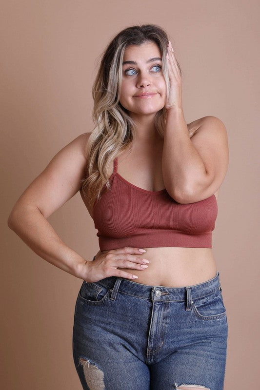 a woman posing for a picture with her hands on her face