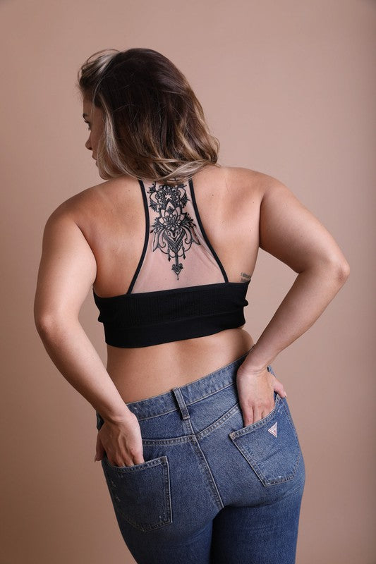 a woman with a tattoo on her back