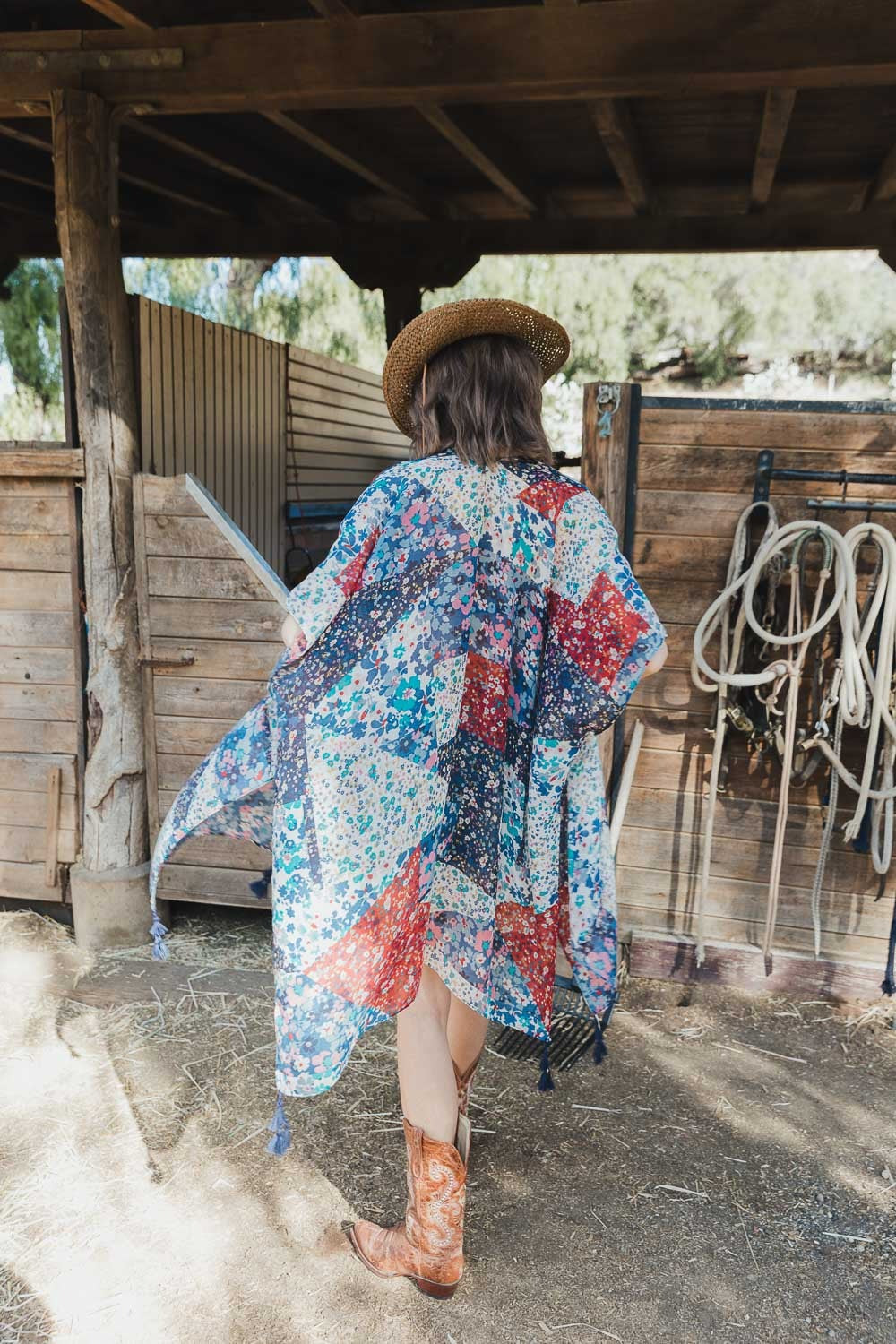 Floral print kimono in navy, side or back angle showing longline length and drape

