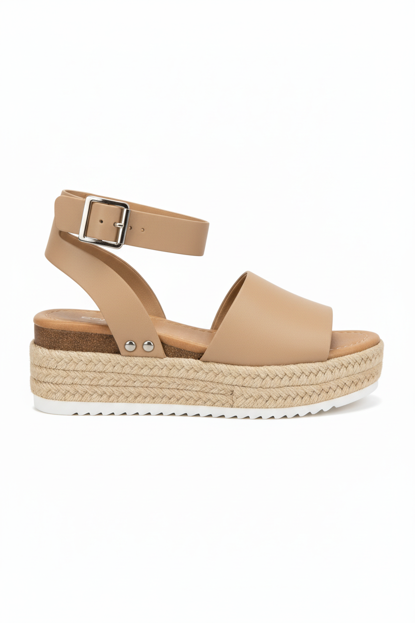 Beige sandal with a woven sole on a white background