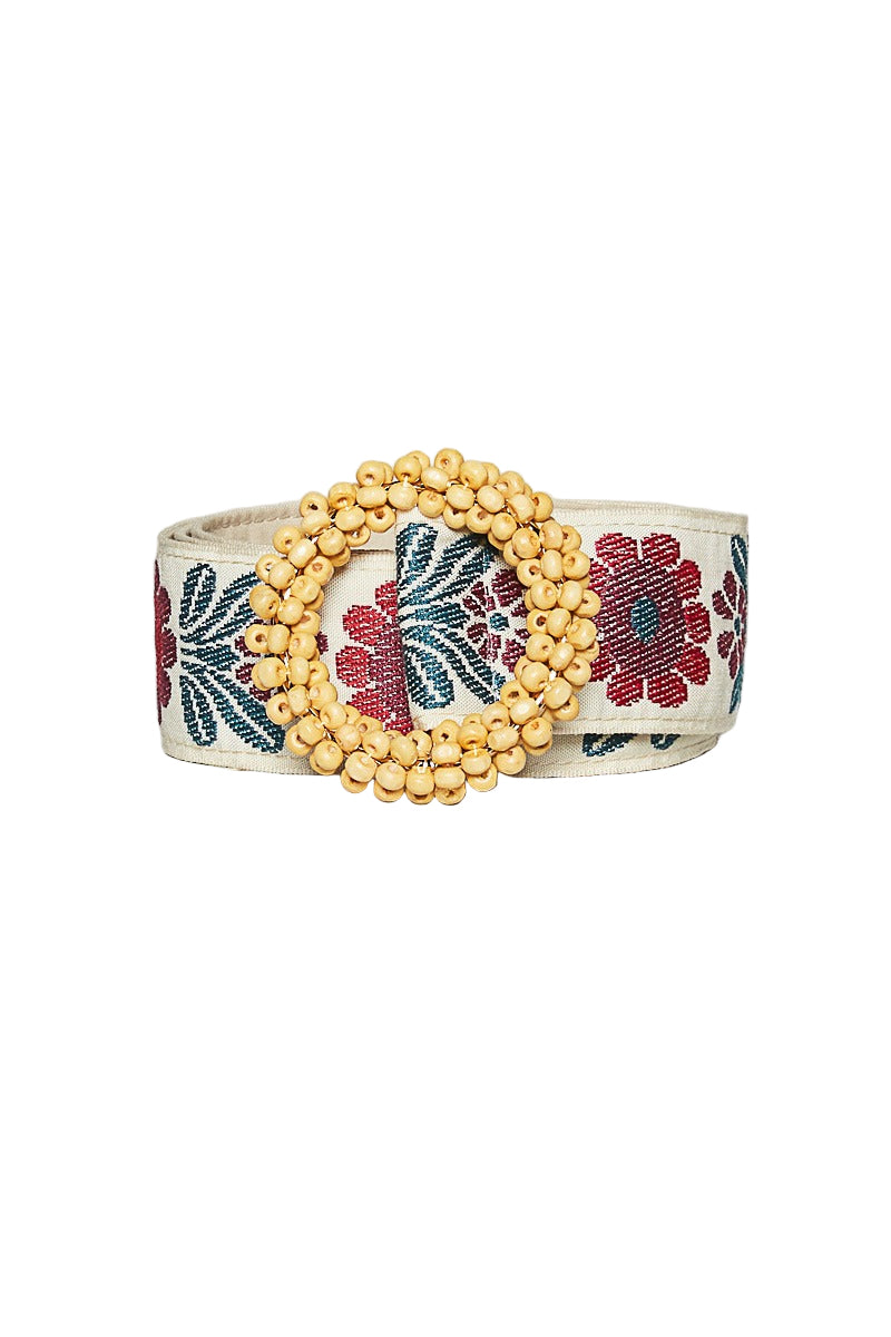 Decorative belt with floral patterns and gold beads on a white background