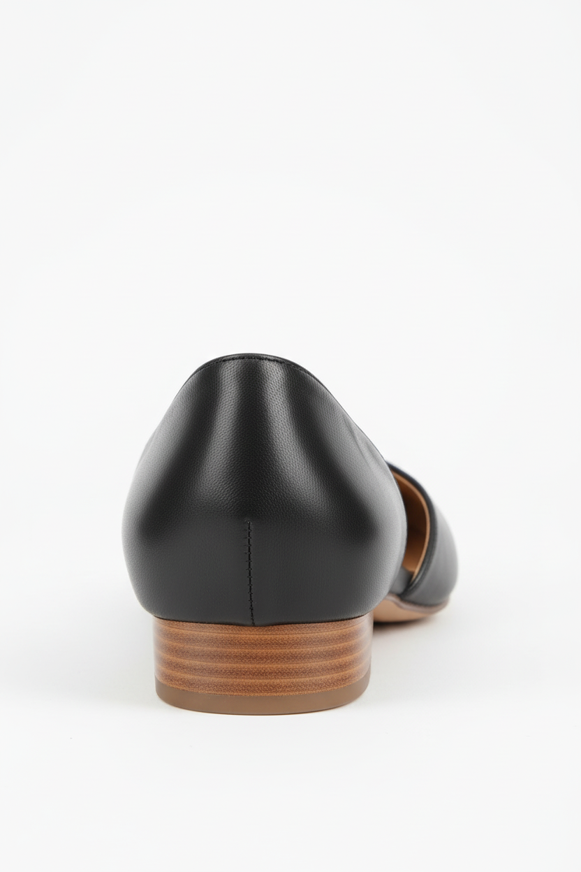 Black leather shoe with a wooden sole on a white background