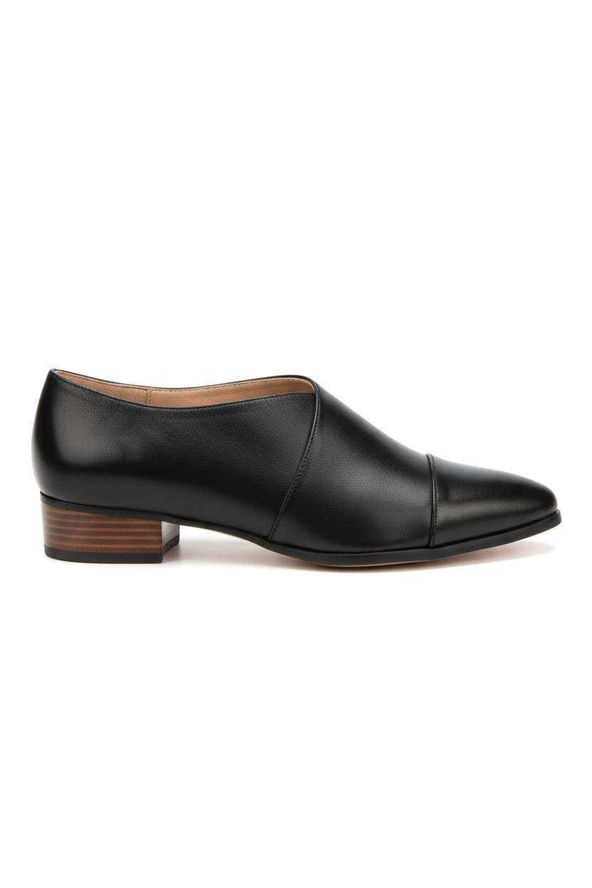 Black leather shoe on a white background