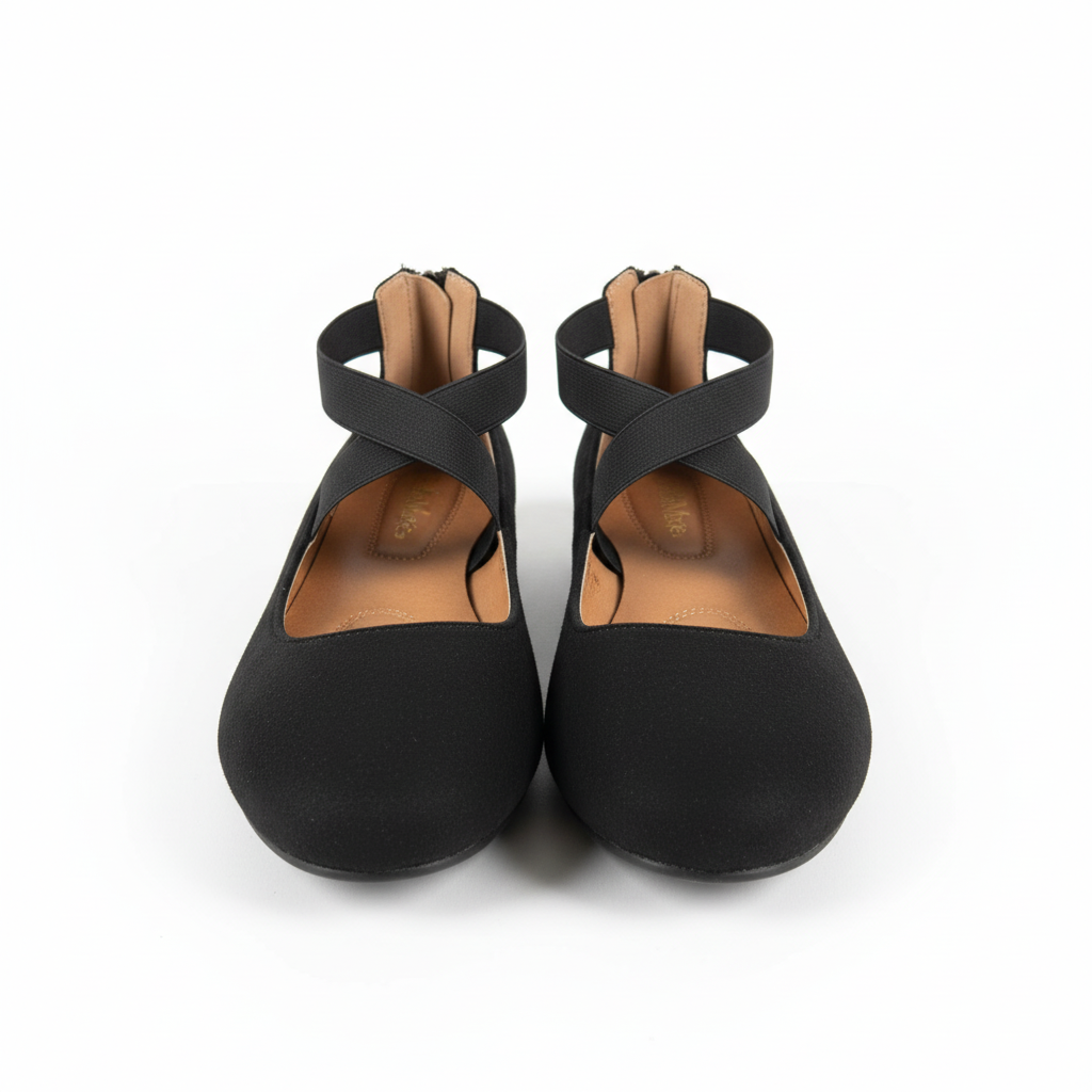 Pair of black flat shoes with criss-cross straps on a white background