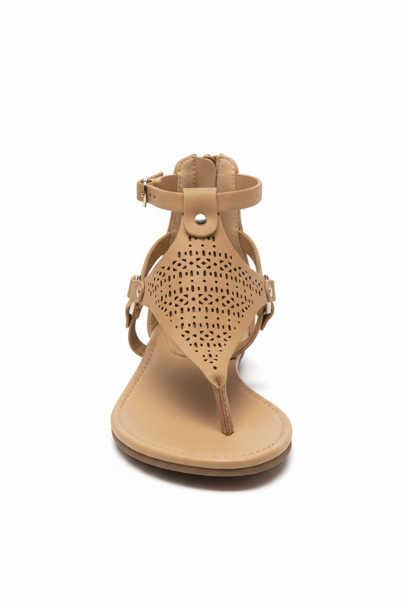 Beige sandal with perforated design on a white background