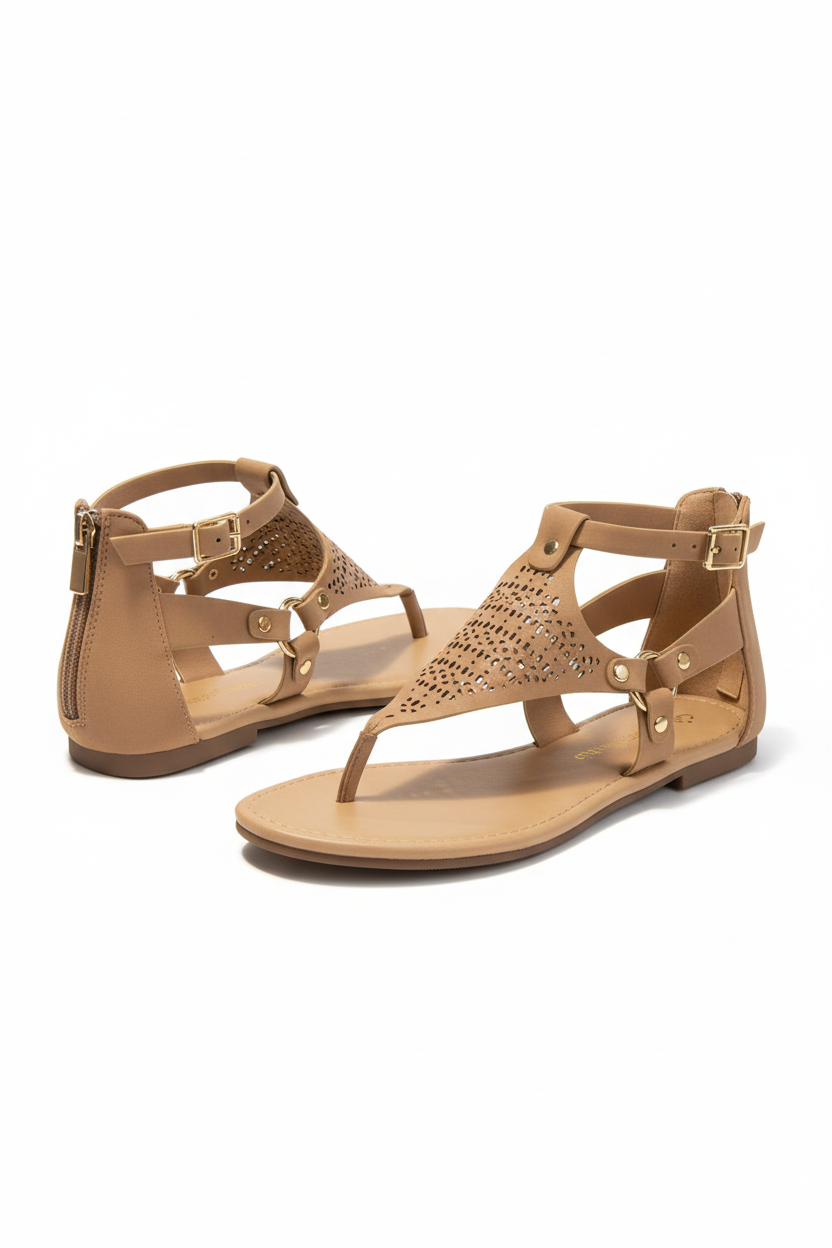 Pair of tan sandals with cut-out design on a white background