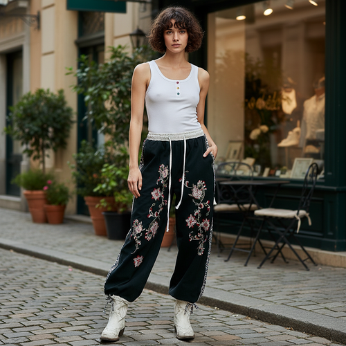 Black wide leg pants styled with model standing near boutique storefront - BellanBlue