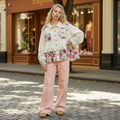 Women's Bluevelvet cream floral patch oversized top with lace trim, styled on boutique street - BellanBlue