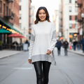 Women's white striped knit pullover sweater styled for a casual city street walk fall outfit - BellanBlue